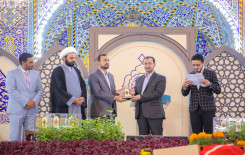 راية المولى أبيّ الفضل العباس تعانق راية أمير المؤمنين بعد حصول فريق النجف الأشرف على المركز الأول في المسابقة القرآنية الفرقية الوطنية الخامسة